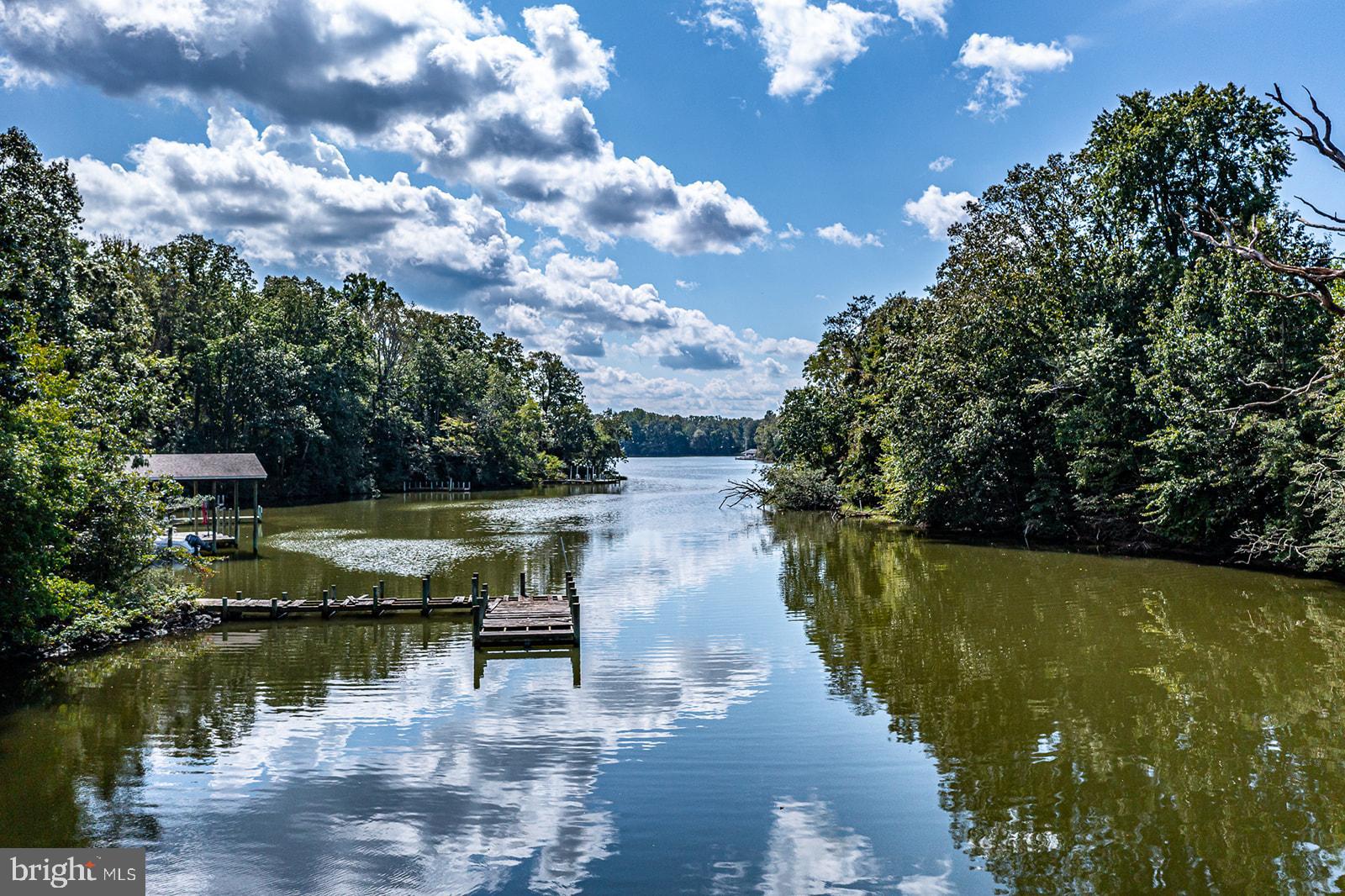 710 Train Lane Heathsville, VA 22473 - Photo 54 of 59 a view of a lake with a yard