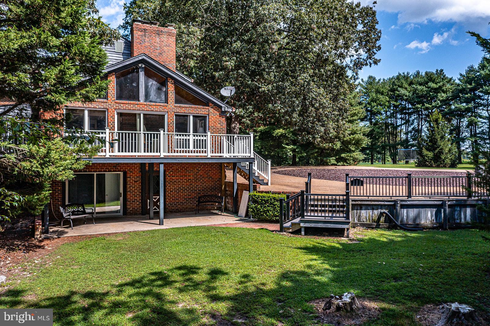 710 Train Lane Heathsville, VA 22473 - Photo 55 of 59 a view of a house with a yard porch and sitting area