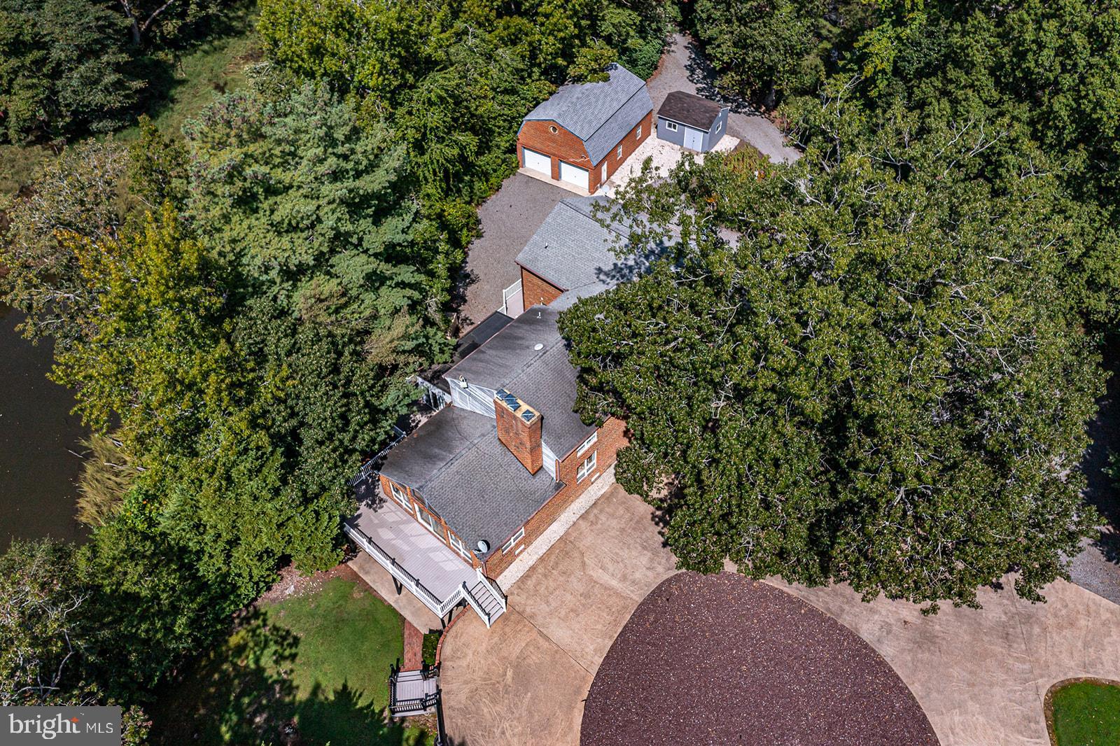 710 Train Lane Heathsville, VA 22473 - Photo 59 of 59 an aerial view of a house with a yard and trees