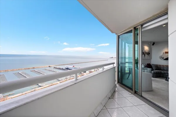 a view of a living room with kitchen