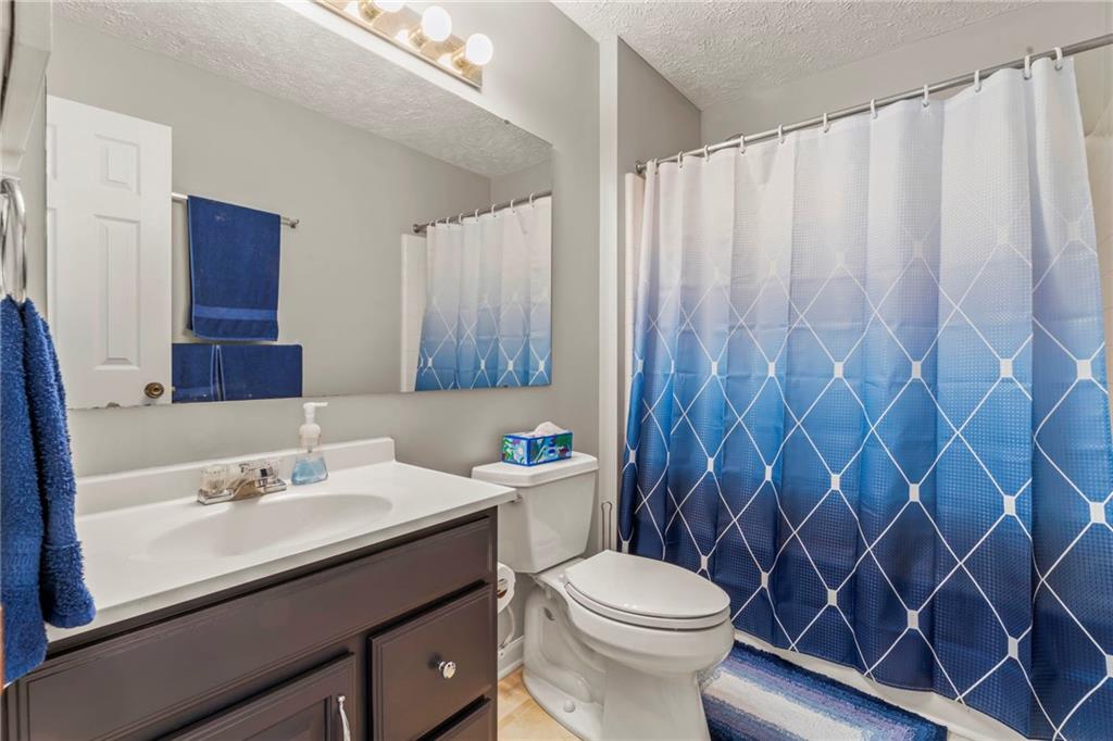 553 Hoover Drive Apollo, PA 15613 - Photo 26 of 35 a bathroom with a sink a toilet and shower curtain