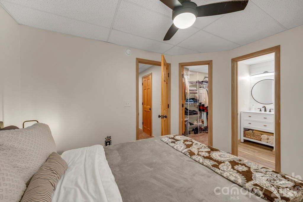 192 Dewitt Barnett Road, Unit 2 Vilas, NC 28692 - Photo 30 of 32 a bedroom with a bed dresser and a large mirror