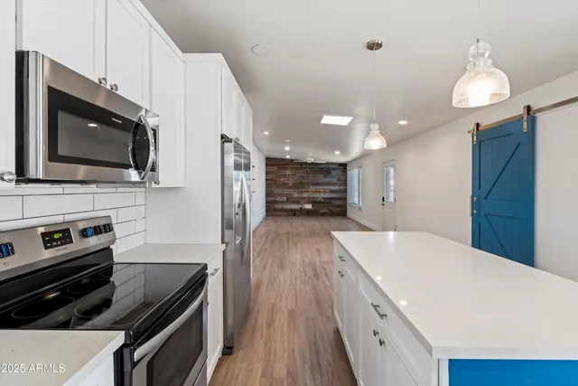 a kitchen with a stove and a microwave