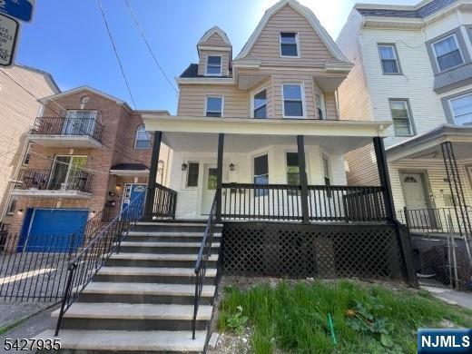 120 South 7th Street, Unit 3 Newark, NJ 07107 - Photo 1 of 5 a view of a brick house with many windows and a gate