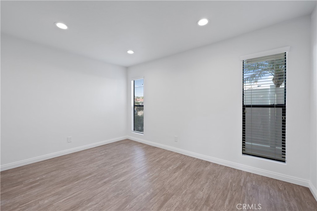 454 Seaward Road Corona del Mar, CA 92625 - Photo 13 of 33 wooden floor in an empty room with a window