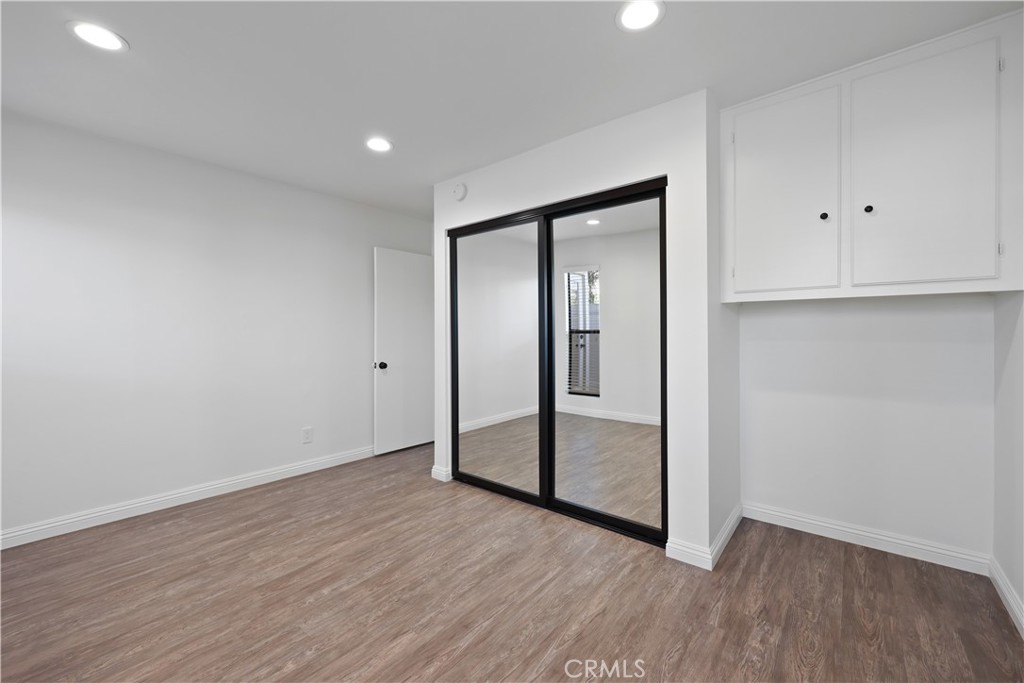 454 Seaward Road Corona del Mar, CA 92625 - Photo 14 of 33 a view of an empty room with wooden floor and closet