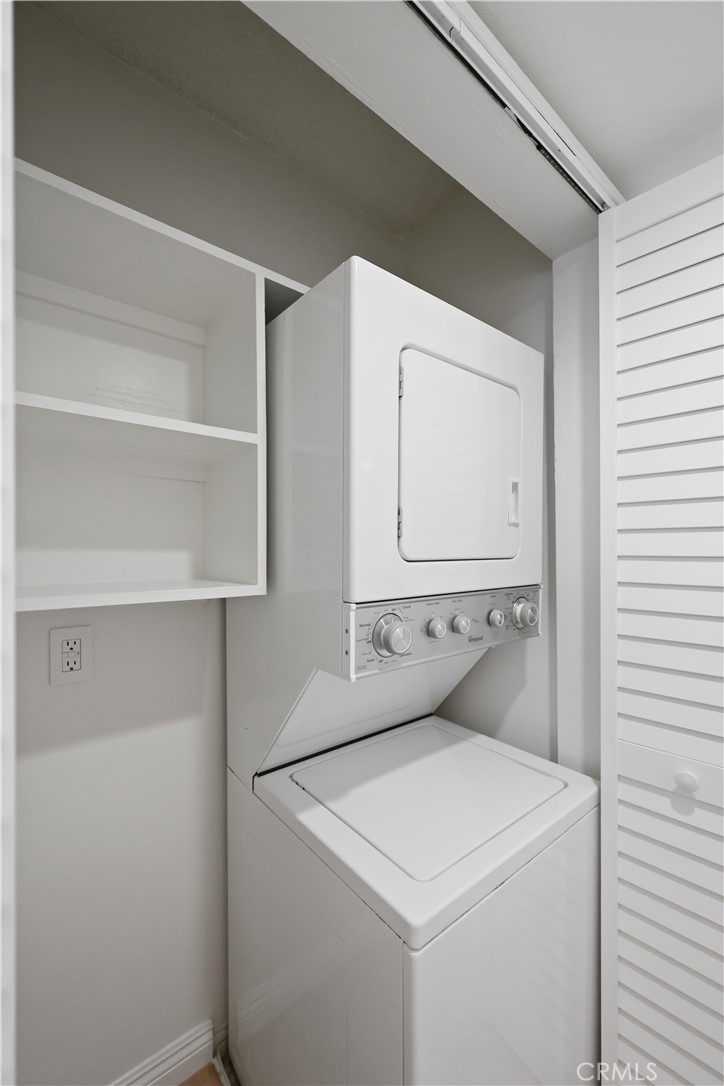 454 Seaward Road Corona del Mar, CA 92625 - Photo 17 of 33 a utility room with cabinets washer and dryer