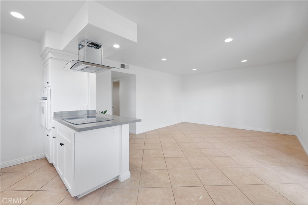 454 Seaward Road Corona del Mar, CA 92625 - Photo 7 of 33 a kitchen with granite countertop a sink and a stove