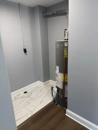 a room with a small space and a wooden floor