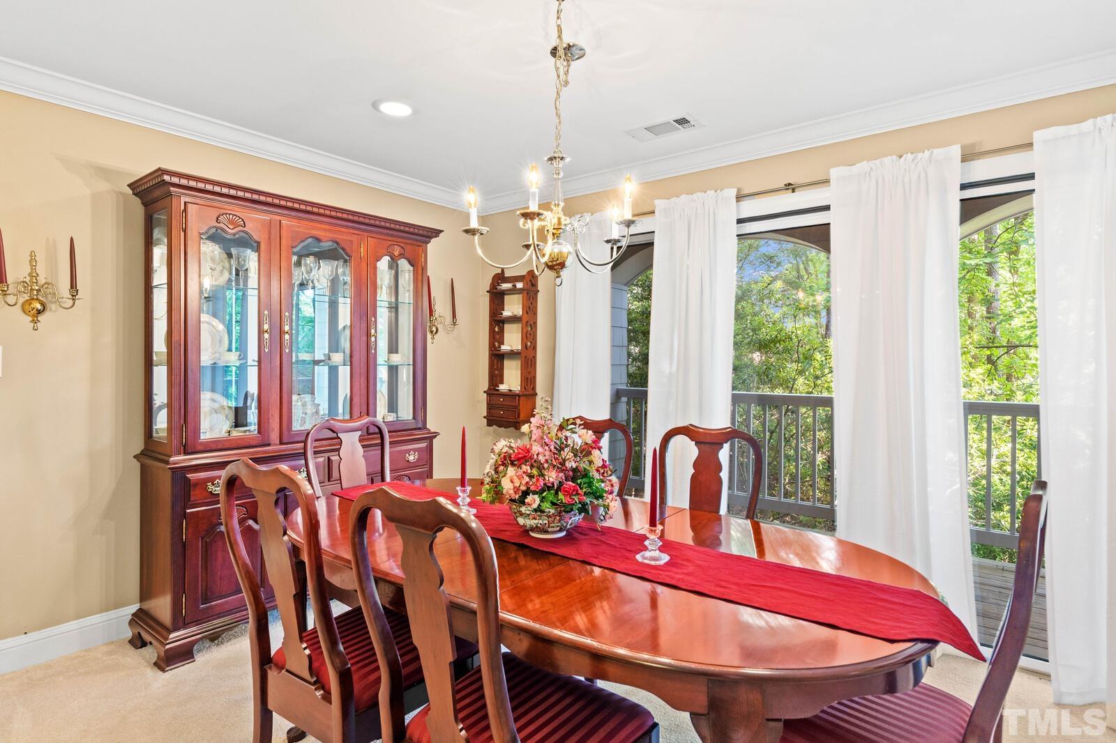 7500 Cadbury Court, Unit 101 Raleigh, NC 27615 - Photo 11 of 41 a dining room with furniture and window