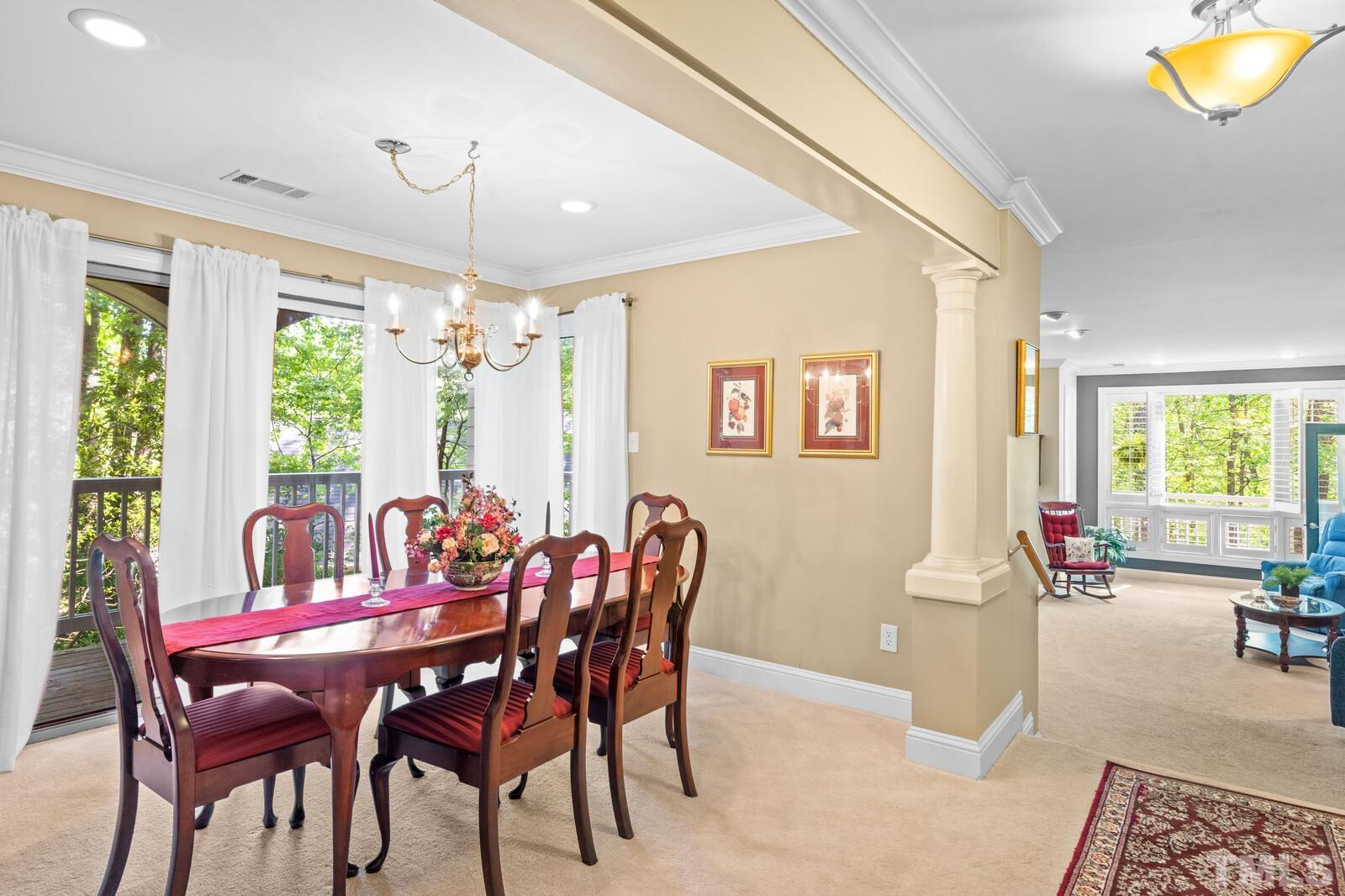 7500 Cadbury Court, Unit 101 Raleigh, NC 27615 - Photo 12 of 41 a view of a dining room with furniture window and outside view