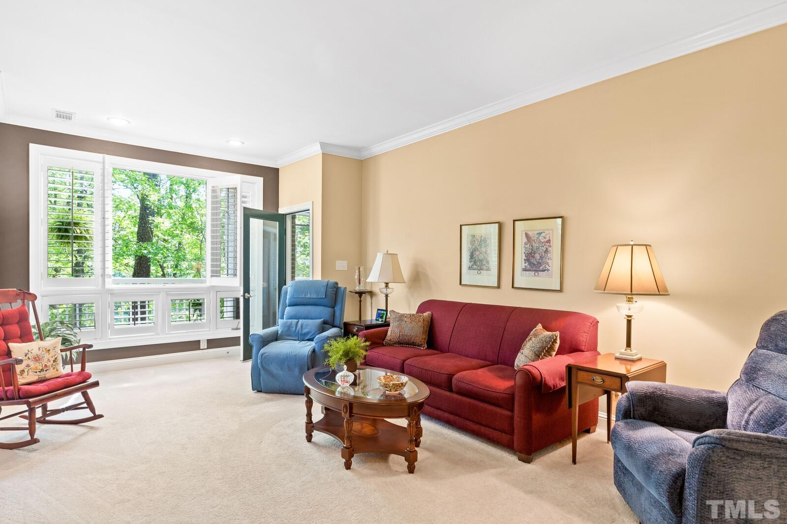 7500 Cadbury Court, Unit 101 Raleigh, NC 27615 - Photo 15 of 41 a living room with furniture and a large window