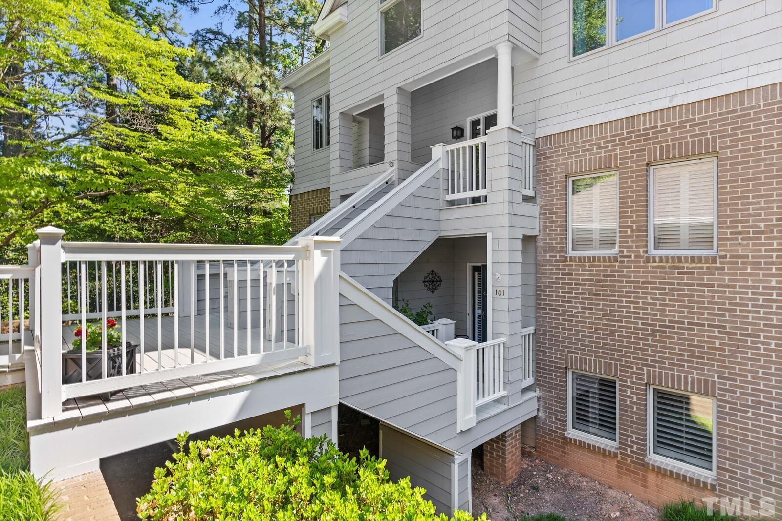 7500 Cadbury Court, Unit 101 Raleigh, NC 27615 - Photo 2 of 41 a view of a house with a small deck