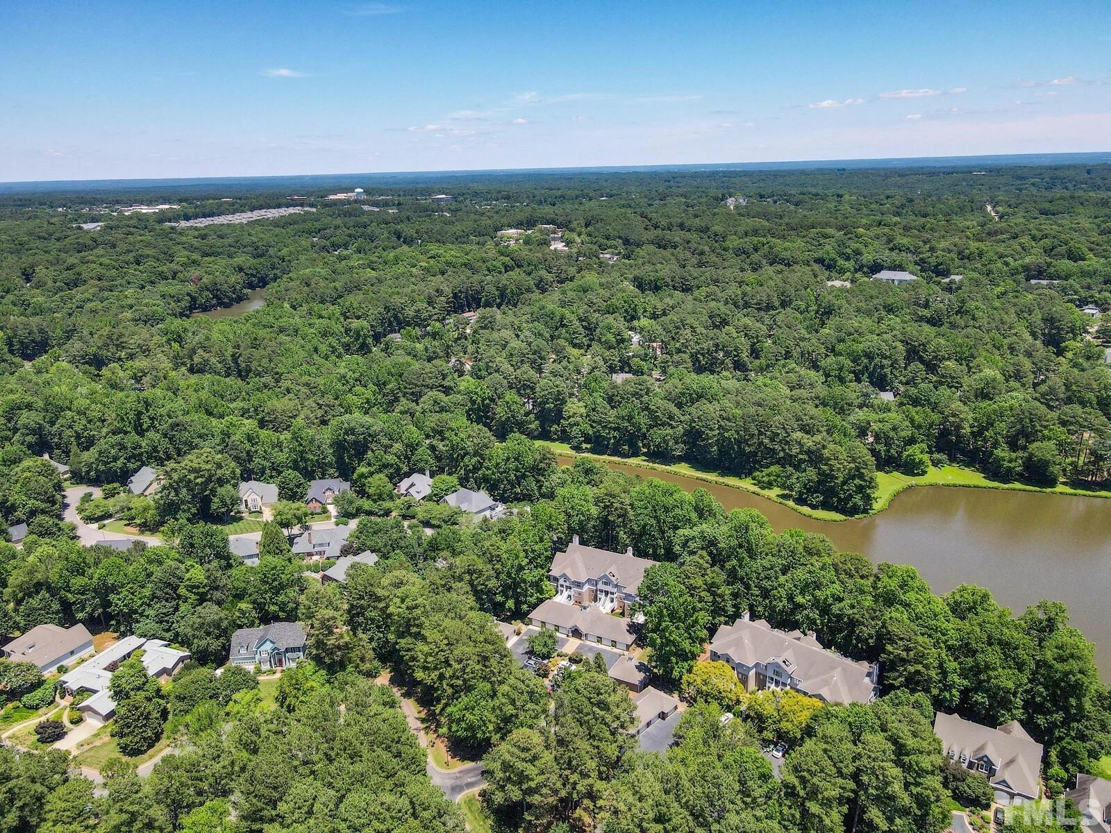 7500 Cadbury Court, Unit 101 Raleigh, NC 27615 - Photo 33 of 41 an aerial view of residential houses with outdoor space and trees
