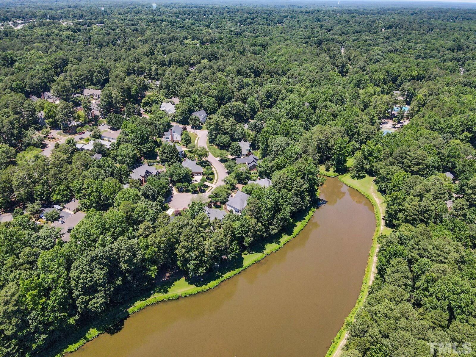 7500 Cadbury Court, Unit 101 Raleigh, NC 27615 - Photo 35 of 41 an aerial view of a house with a yard and lake view
