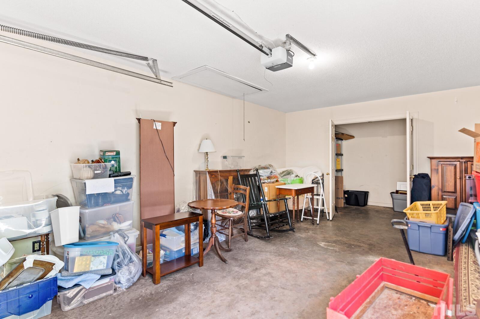 7500 Cadbury Court, Unit 101 Raleigh, NC 27615 - Photo 41 of 41 a living room with furniture and a dining table