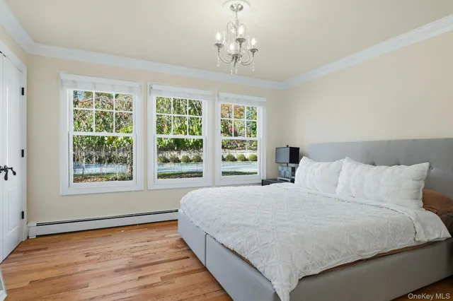 a bedroom with a large bed and a window