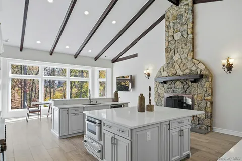 a kitchen with a stove and a white cabinets