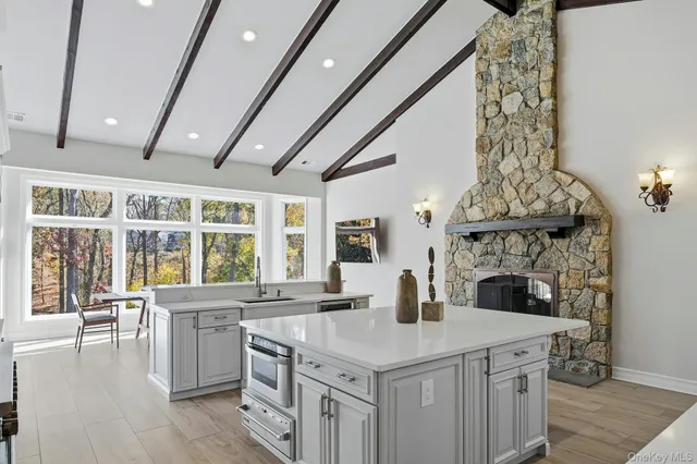 a kitchen with a stove and a white cabinets