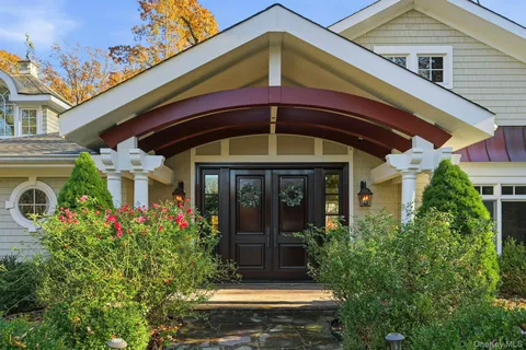 a front view of a house with garden