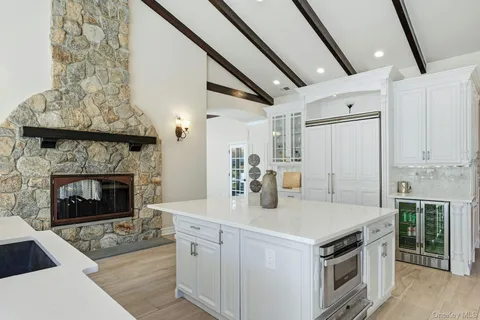 a kitchen with a stove and a fireplace