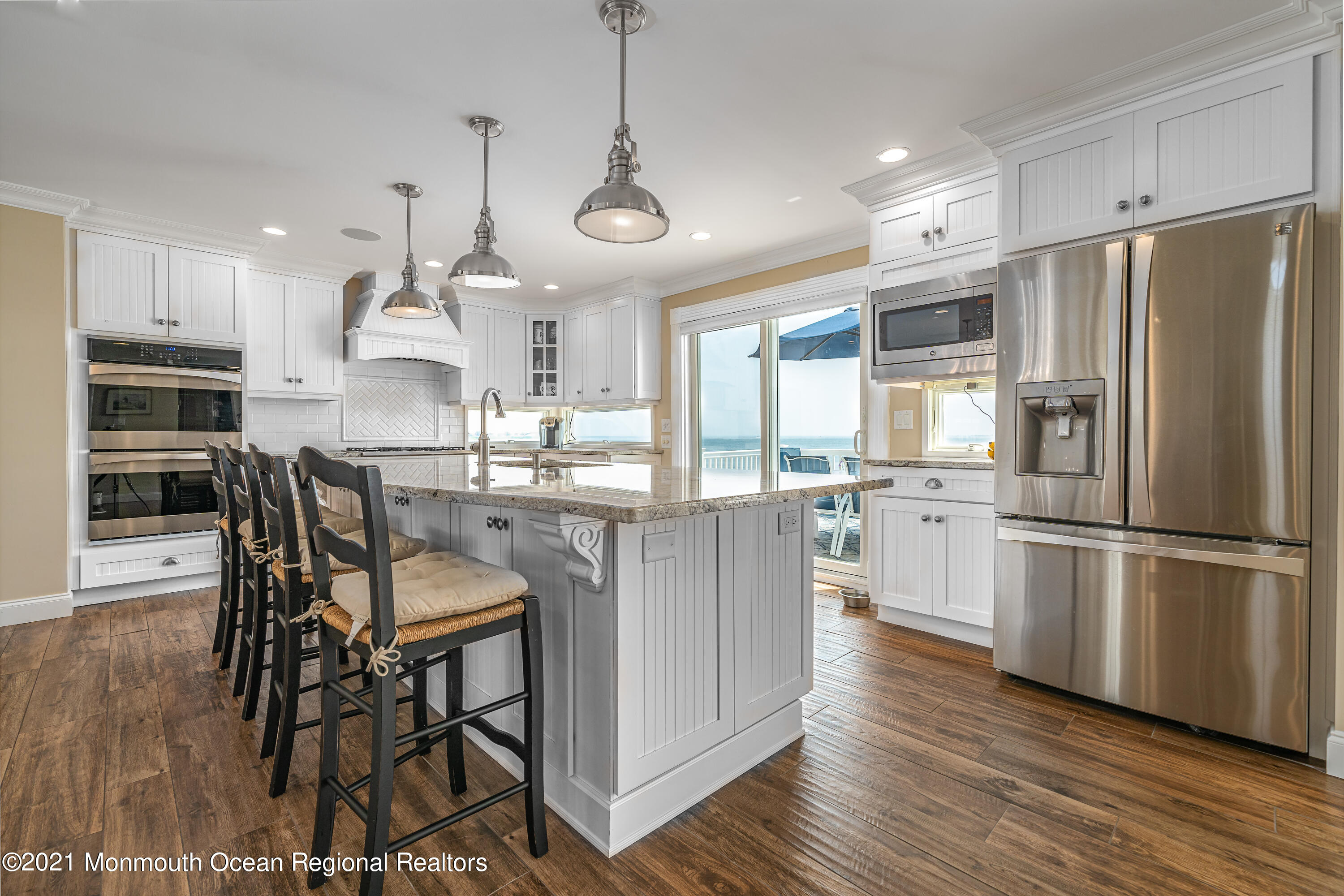 117 Clifton Road Barnegat, NJ 08005 - Photo 15 of 44 a kitchen with granite countertop a center island stainless steel appliances cabinets and a wooden floor