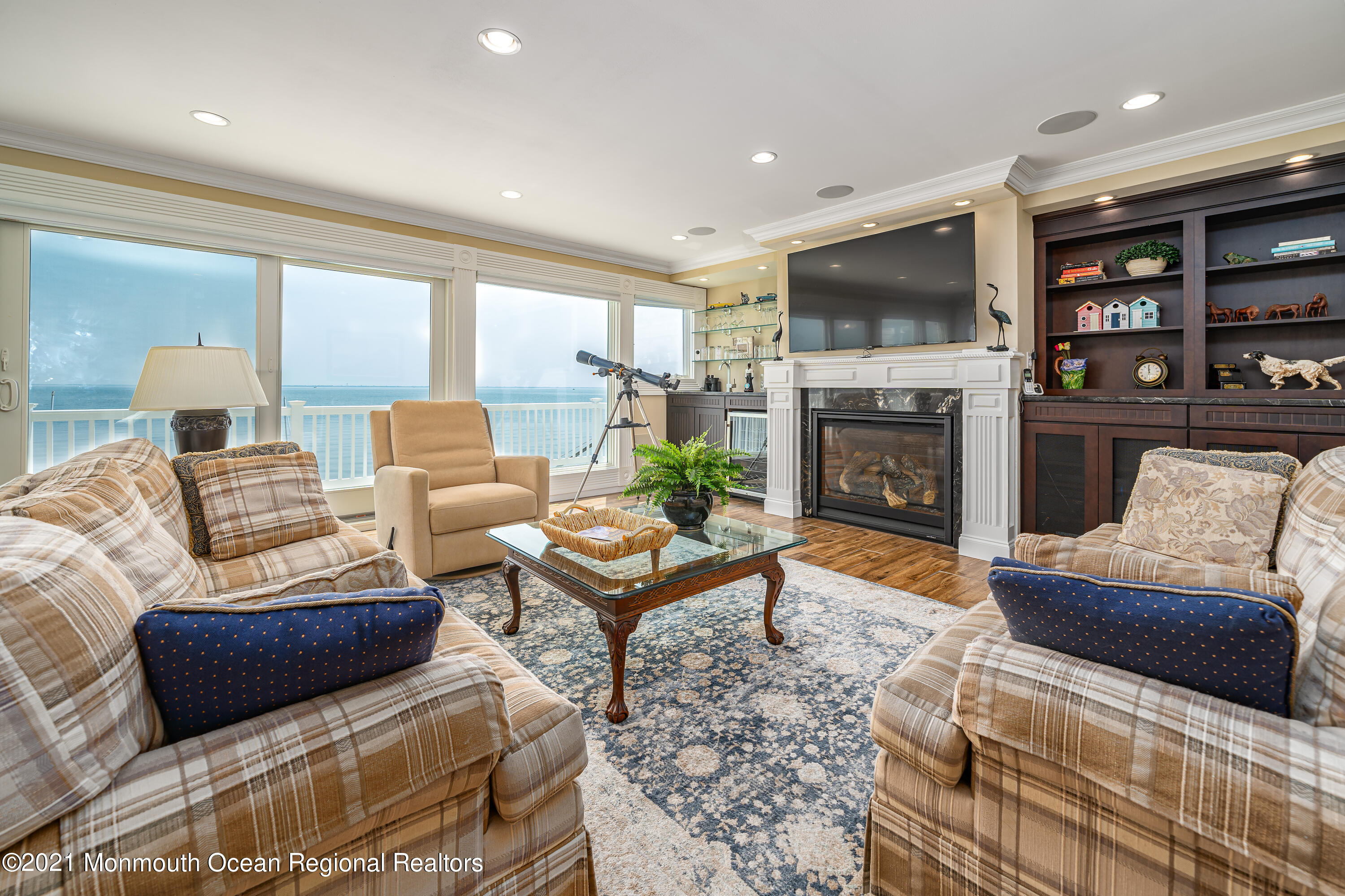 117 Clifton Road Barnegat, NJ 08005 - Photo 21 of 44 a living room with furniture a flat screen tv and a fireplace