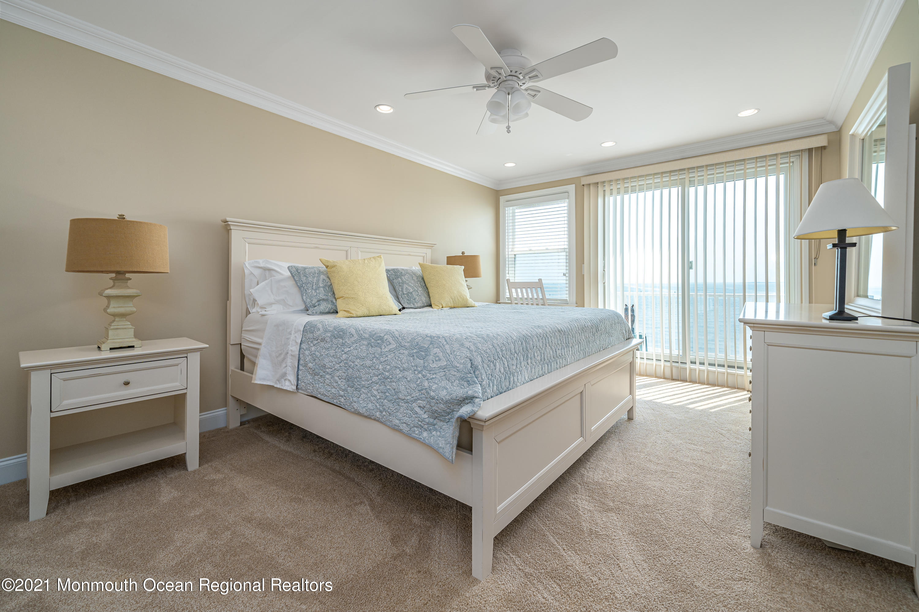 117 Clifton Road Barnegat, NJ 08005 - Photo 23 of 44 a spacious bedroom with a bed and a chandelier