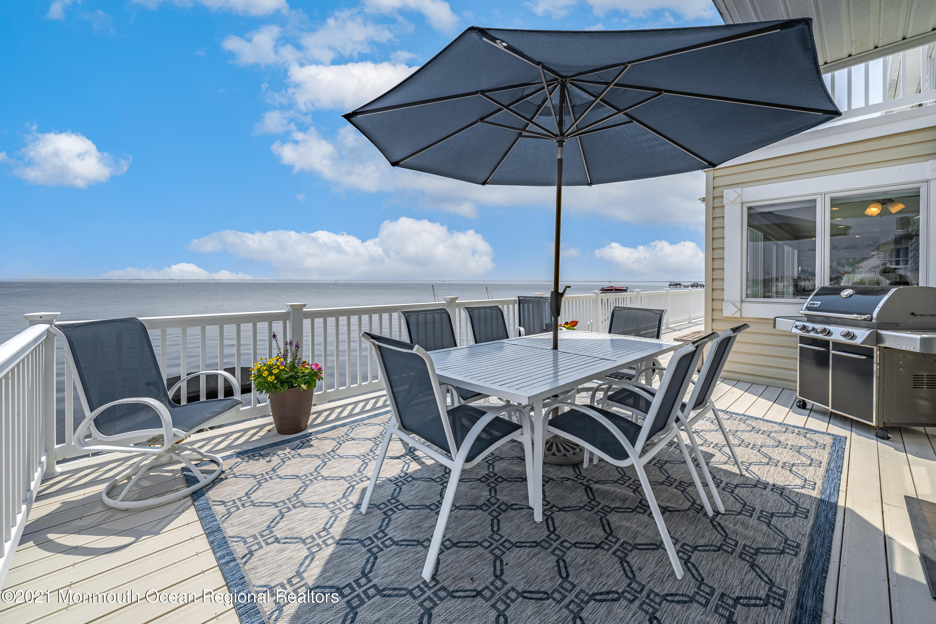 117 Clifton Road Barnegat, NJ 08005 - Photo 39 of 44 a view of a patio with table and chairs under an umbrella