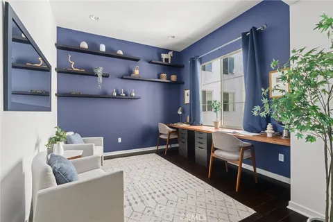 a living room with furniture a window and a table
