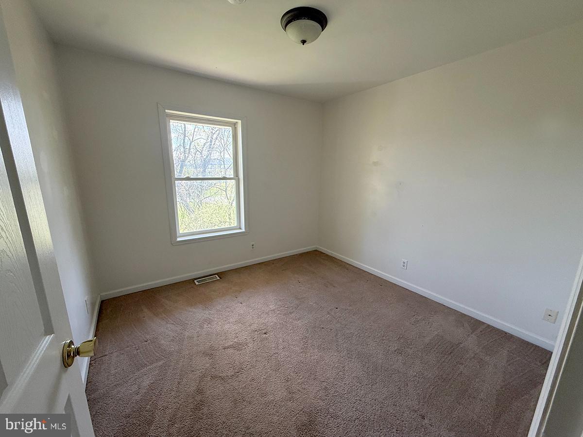 1121 Montour Road Loysville, PA 17047 - Photo 17 of 20 an empty room with windows