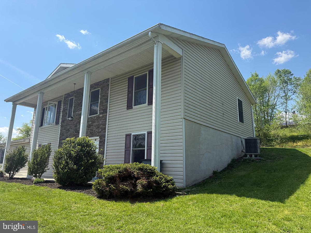 1121 Montour Road Loysville, PA 17047 - Photo 2 of 20 a front view of a house with a garden