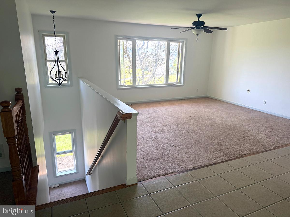 1121 Montour Road Loysville, PA 17047 - Photo 3 of 20 a view of an empty room with a window