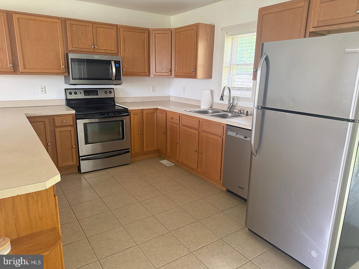 1121 Montour Road Loysville, PA 17047 - Photo 5 of 20 a kitchen with a refrigerator sink and microwave
