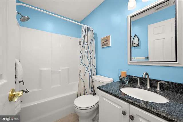 a view of a lake yard with a table and chairs