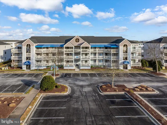 a view of a lake with boats and trees in the background