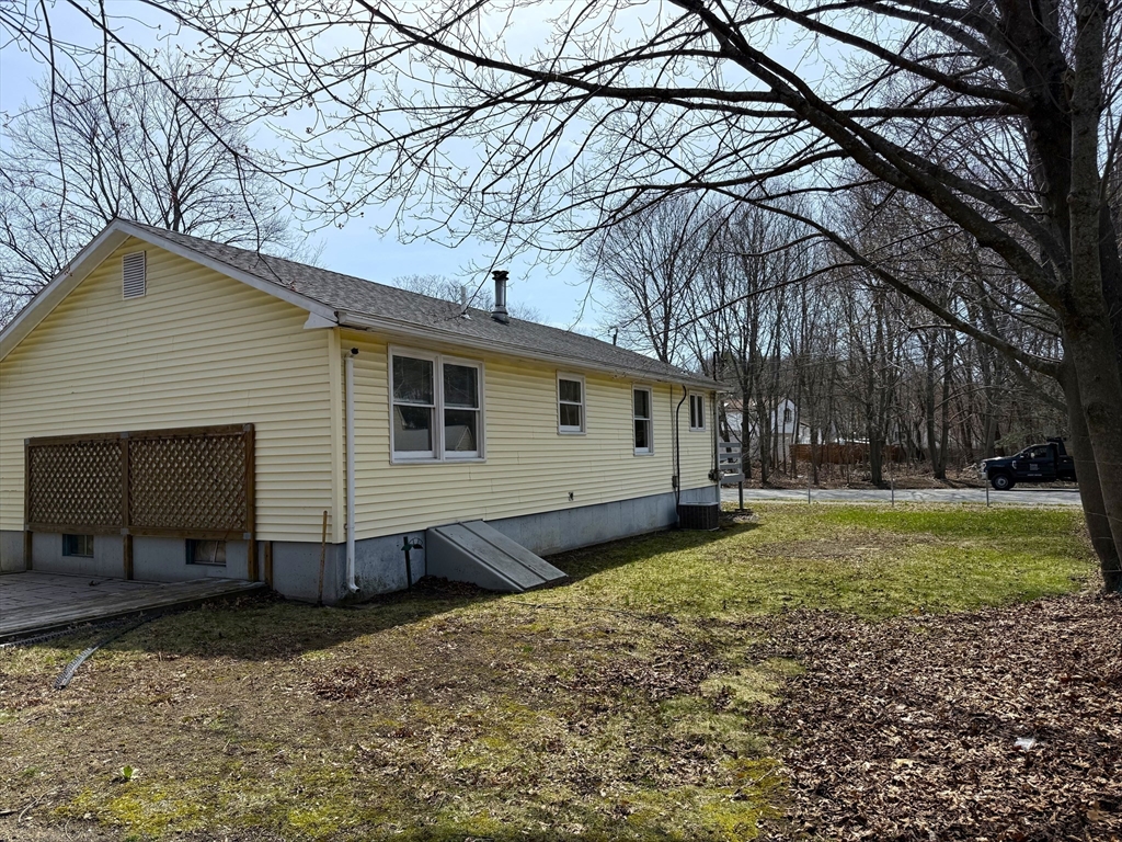 1 Joyce Road Peabody, MA 01960 - Photo 12 of 12 a view of a backyard with large trees