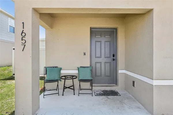 a view of a hallway with seating area