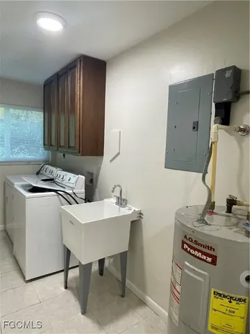 a kitchen with a sink cabinets and wooden floor