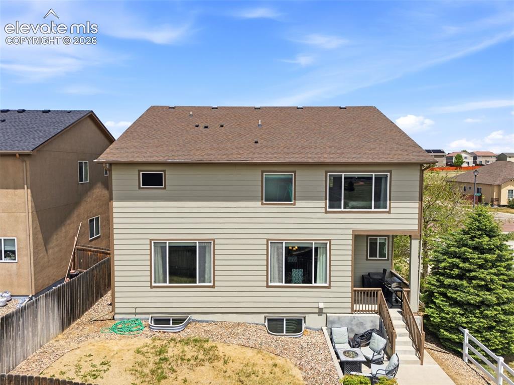 2264 Reed Grass Way Colorado Springs, CO 80915 - Photo 46 of 50 a view of a house with a backyard