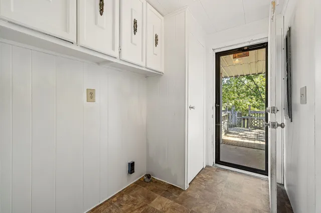 a view of an empty room and a window