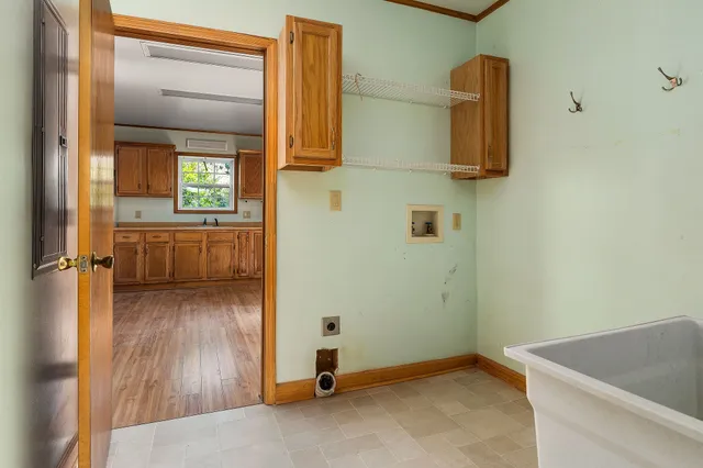 a bathroom with a shower sink and mirror