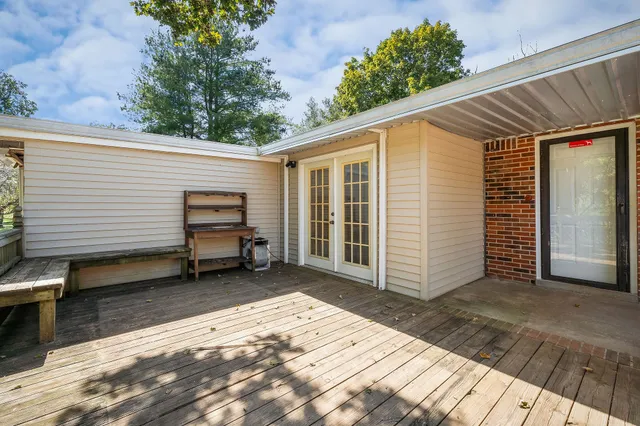 a view of a backyard with a wooden fence