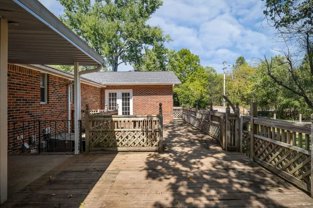 a view of backyard with tub and trees around