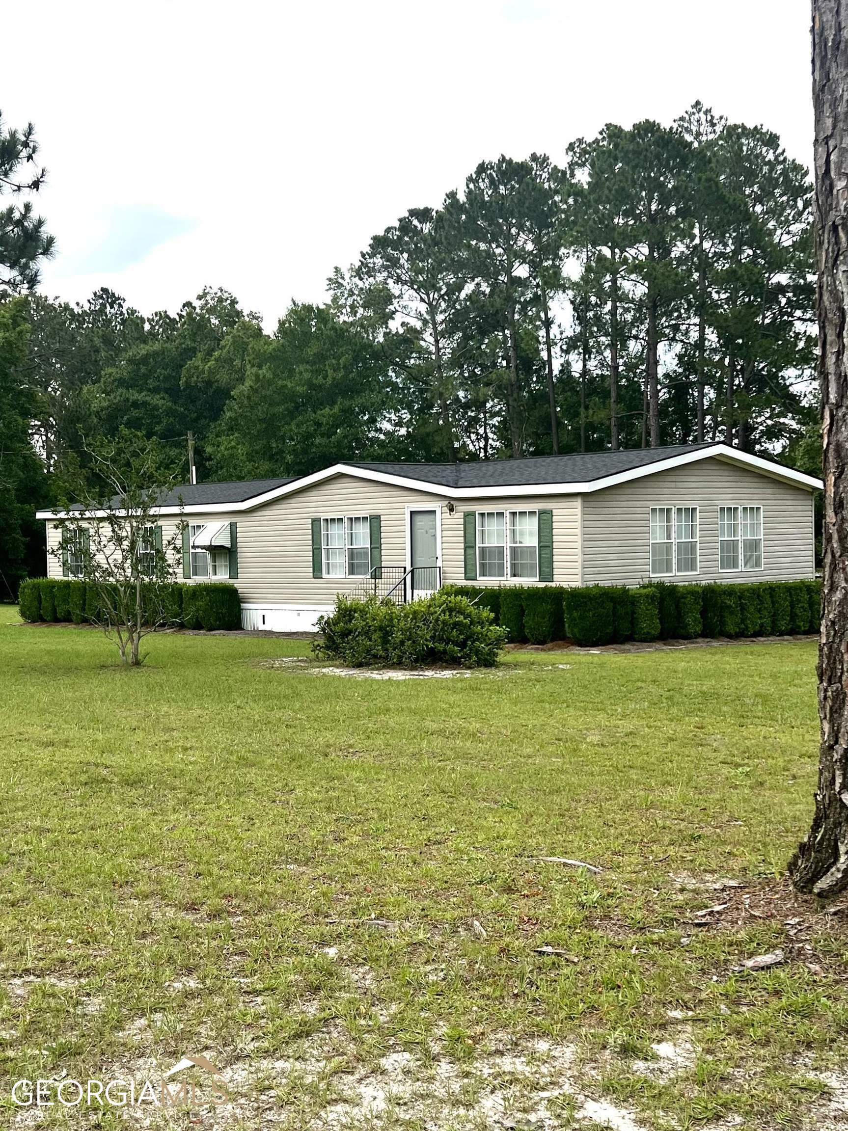 a house view with a garden space