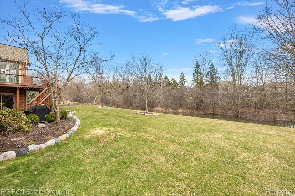 3571 Cedar Brook Drive Rochester, MI 48309 - Photo 11 of 57 View of grassy yard with stairway