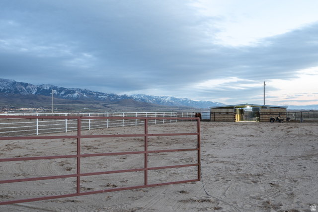 1981 South Main Street Lewiston, UT 84320 - Photo 44 of 47 View of yard with a mountain view, an outdoor structure, a rural view, and an enclosed horse arena