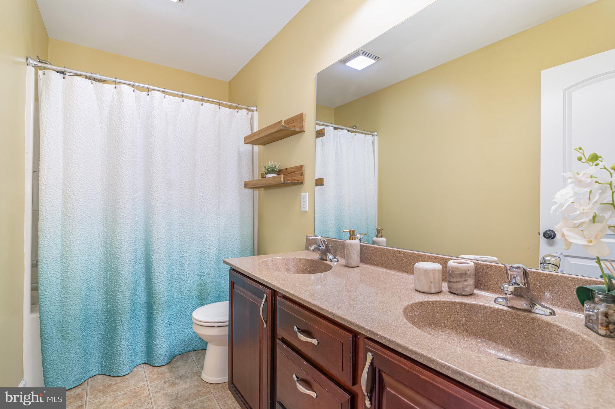 2786 Silver Maple Drive Harrisburg, PA 17112 - Photo 16 of 25 a bathroom with a granite countertop sink and a mirror