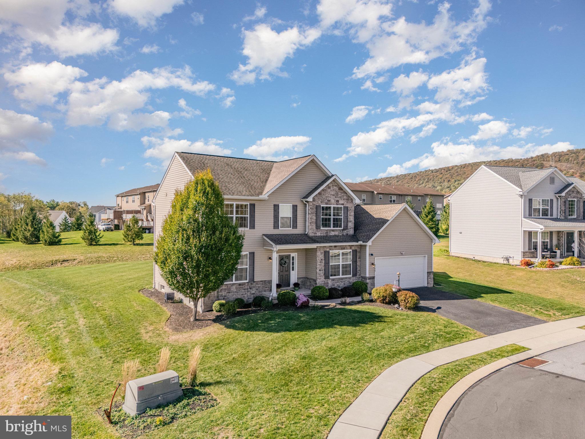 2786 Silver Maple Drive Harrisburg, PA 17112 - Photo 22 of 25 a front view of a house with garden