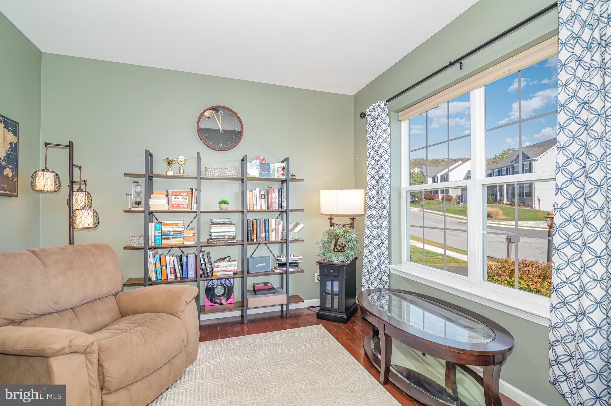 2786 Silver Maple Drive Harrisburg, PA 17112 - Photo 8 of 25 a living room with furniture a rug and a large window